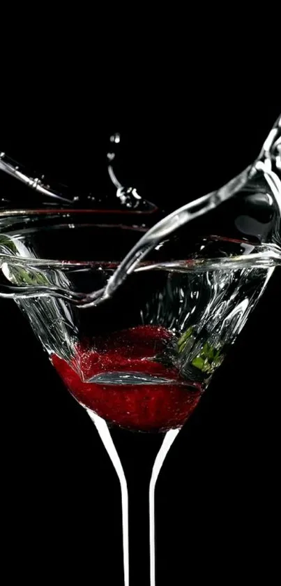 Martini glass with a vivid liquid splash against a black background.