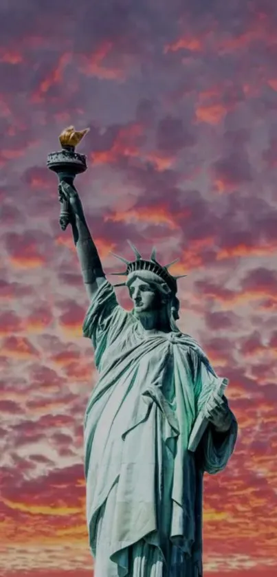 Statue of Liberty against a vibrant purple sunset.