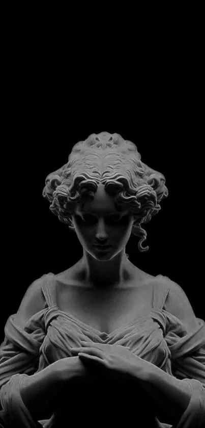 Elegant stone statue on a dark background wallpaper.