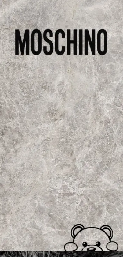 Gray stone texture wallpaper with a playful teddy bear detail.