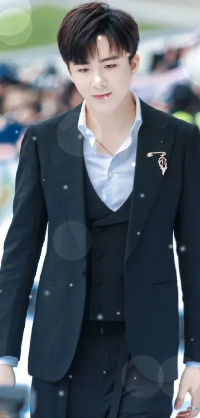 Elegant individual in a dark suit on a bustling streetscape.