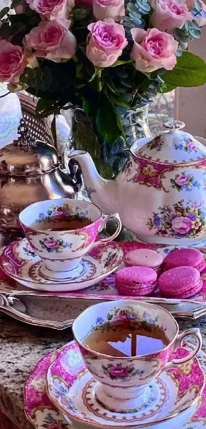 Elegant tea set and pink roses on a tray.