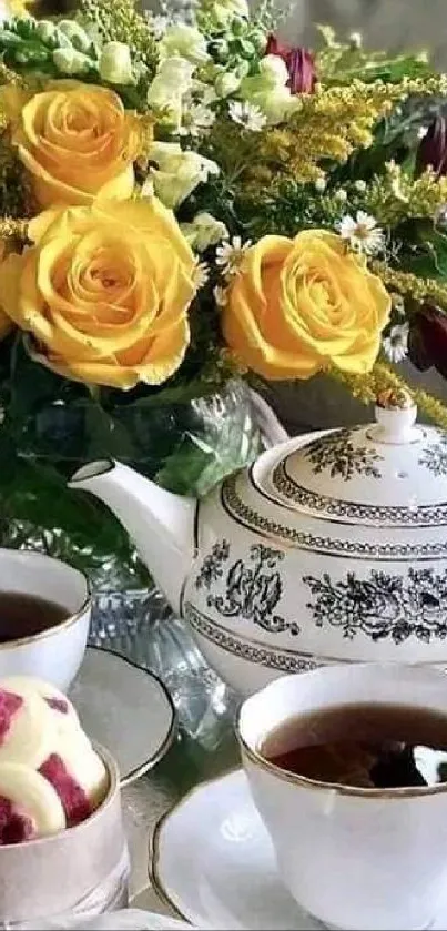 Elegant tea set with yellow roses and cups of tea on a silver tray.