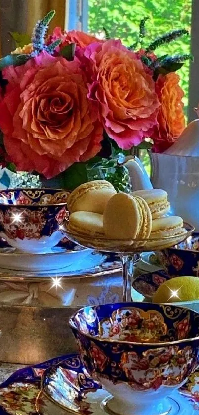 Elegant tea set with roses and macarons by a window.