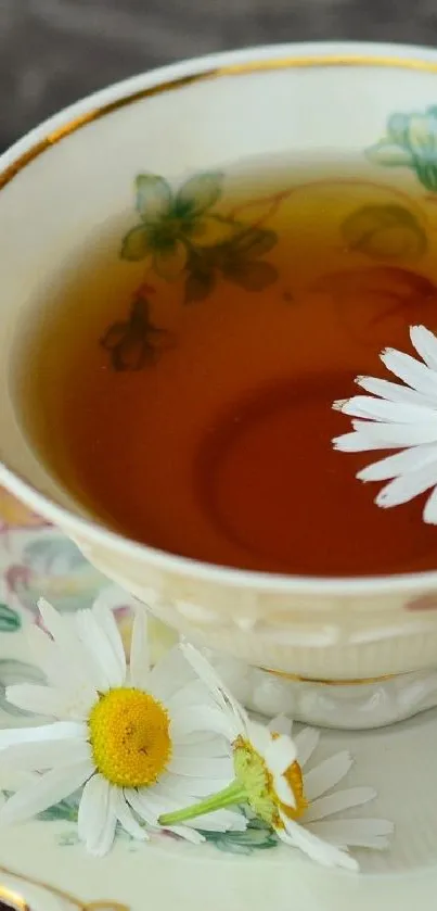 Cup of tea with daisies floating inside.