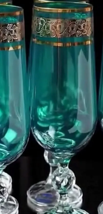 Elegant teal glassware with gold accents.
