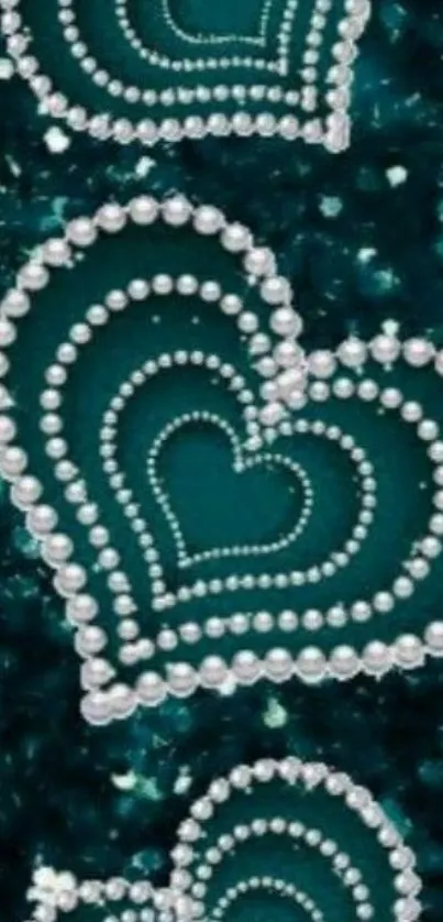 Teal background with pearl heart designs.