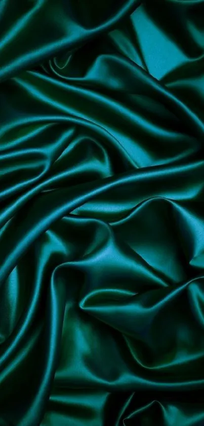 Elegant teal silk texture with smooth folds as mobile wallpaper.