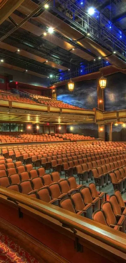 Luxurious theater interior wallpaper with red seats and elegant lighting.