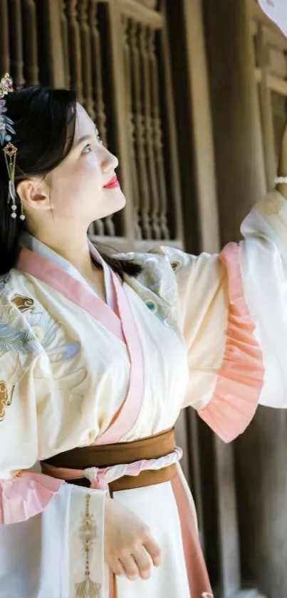 Beautiful woman in hanfu holding fan elegantly.