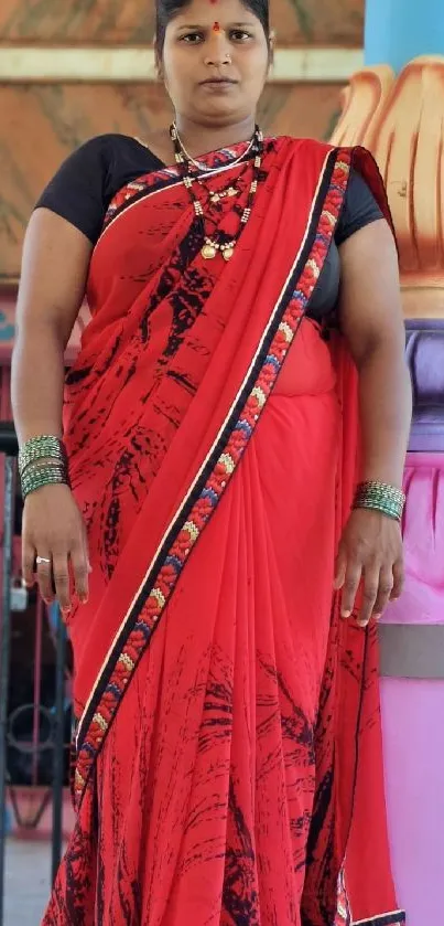 Woman in elegant traditional red sari portrait.