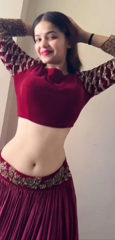 Woman in elegant traditional attire posing gracefully.