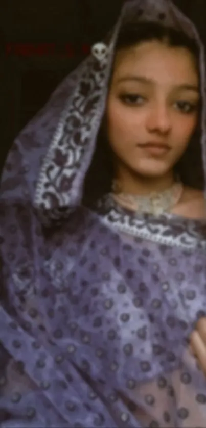 Elegant portrait of a woman in a traditional purple shawl.