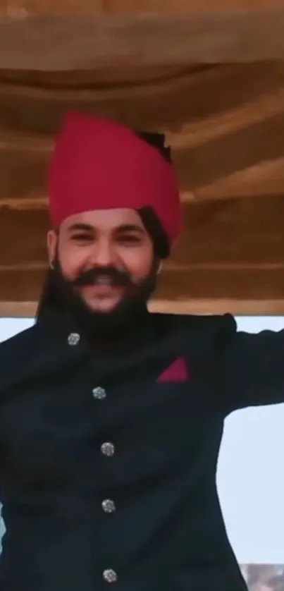 Man in traditional attire, red turban.