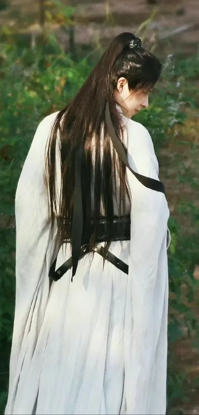 Person in traditional attire with natural background.