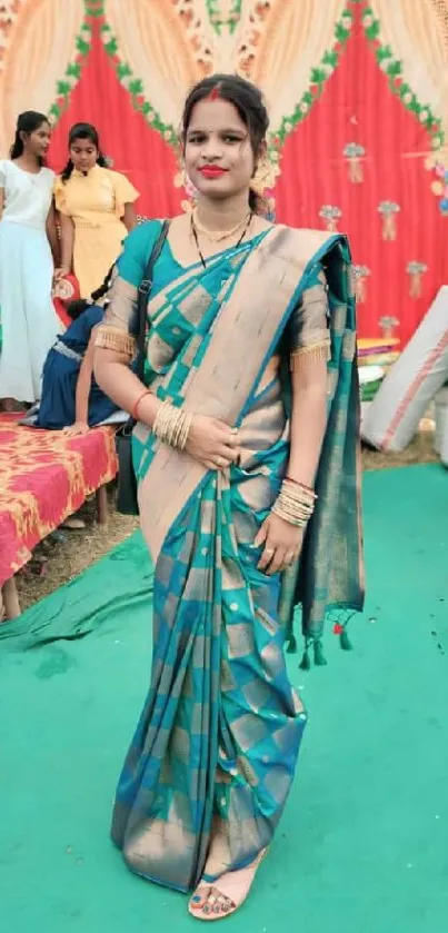 Woman wearing a traditional sari at a cultural event.