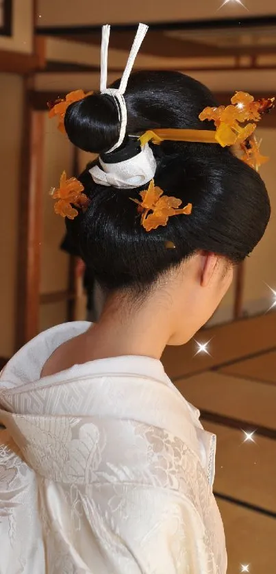 Traditional Japanese hairstyle with floral adornments in an elegant room setting.