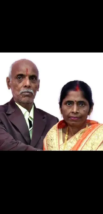 Elegant traditional portrait of a couple in formal attire and rich cultural clothing.