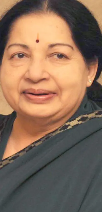 Elegant portrait with green attire and serene expression.