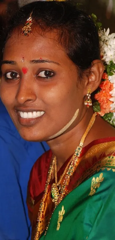 Traditional woman portrait with vibrant attire and floral decorations.