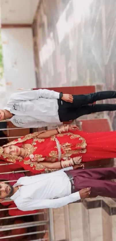 Traditional wedding portrait with red and gold attire.