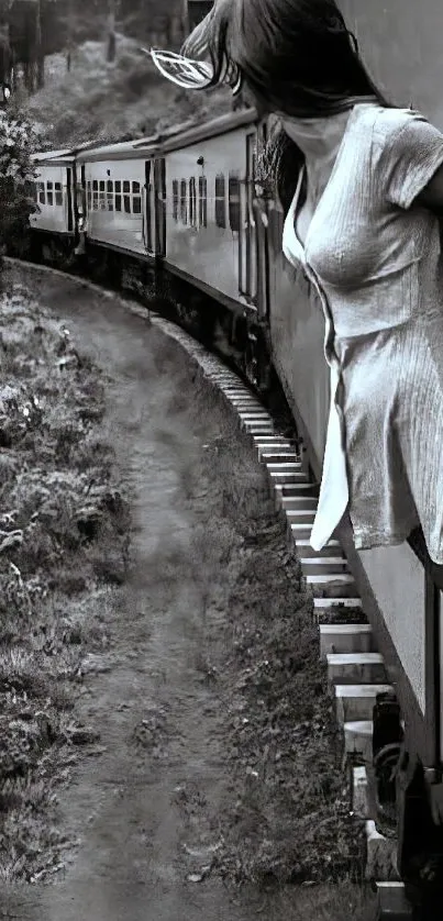 Woman on a train gazing out in black and white.