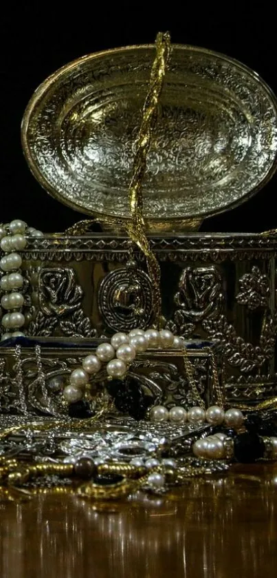 Luxurious treasure chest with pearls and gold chains on wooden table.