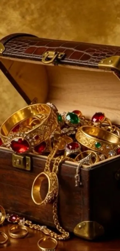 Open treasure chest with gold and gemstones spilling out.