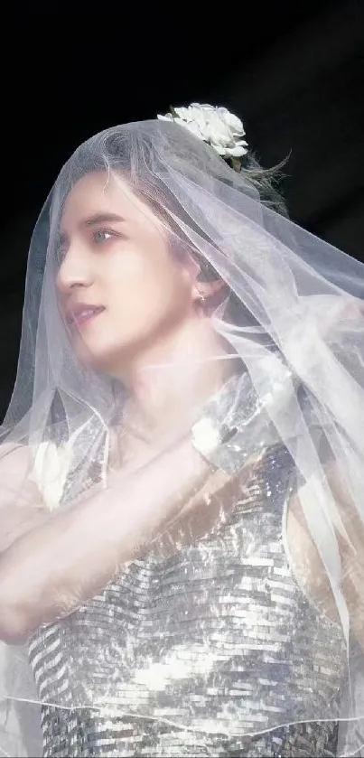 Person in a sparkling dress with veil against dark background.