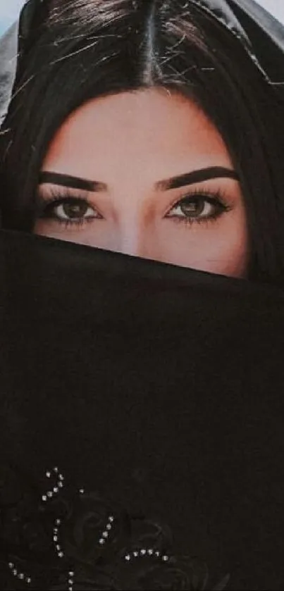 Veiled woman with striking eyes staring intently.