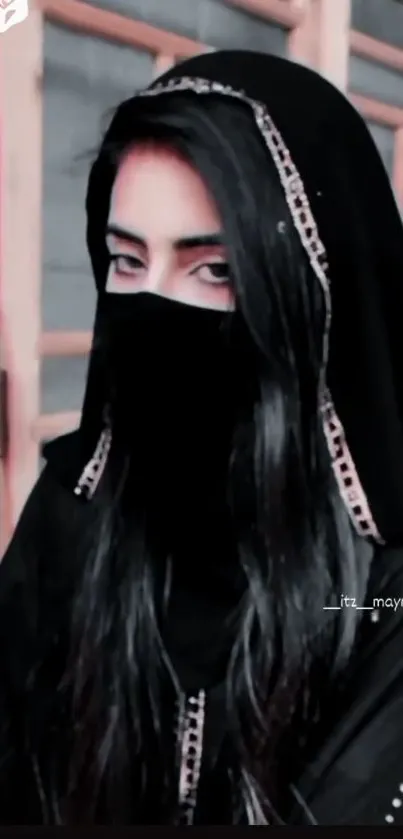 Mysterious veiled woman in black attire.