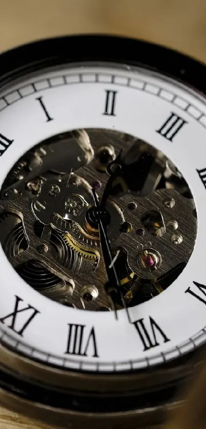 Vintage pocket watch with an open lid on wooden background.