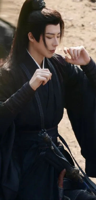 Warrior in black attire on a sandy background, exuding elegance.