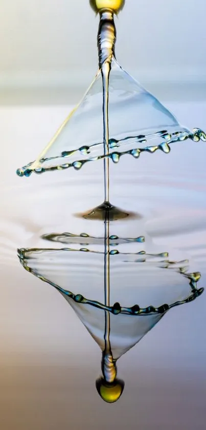 Artistic water droplet splash with reflection on light blue background.