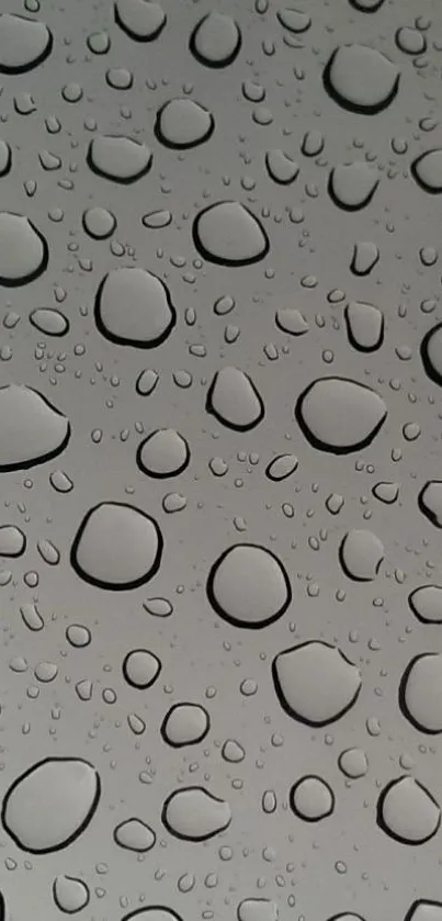 Gray wallpaper with realistic water droplets for mobile devices.