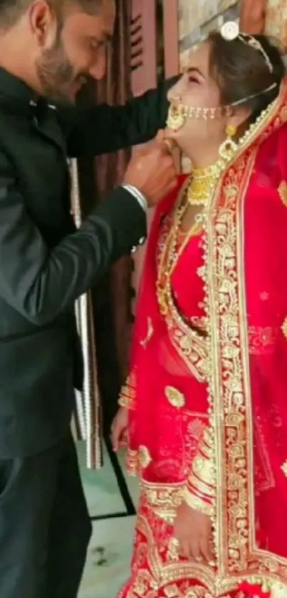 Bride in red Indian wedding attire with groom.