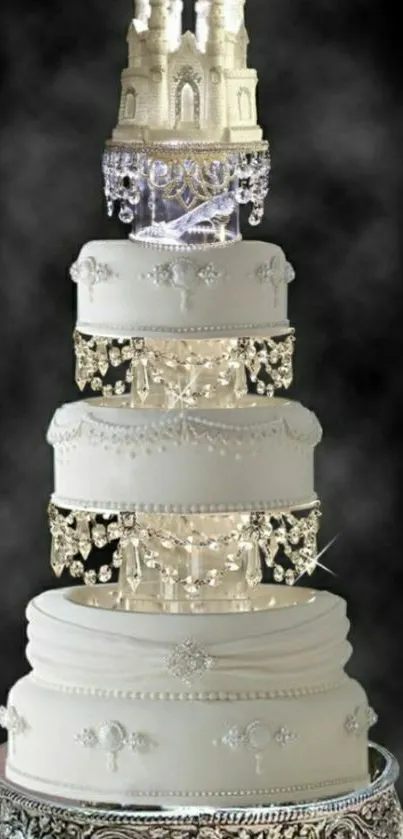 Elegant white wedding cake with castle topper and chandeliers.