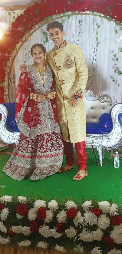 Bride and groom in traditional attire during their vibrant, floral-themed wedding ceremony.