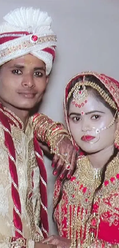 Traditional couple in wedding attire with decorative outfits.