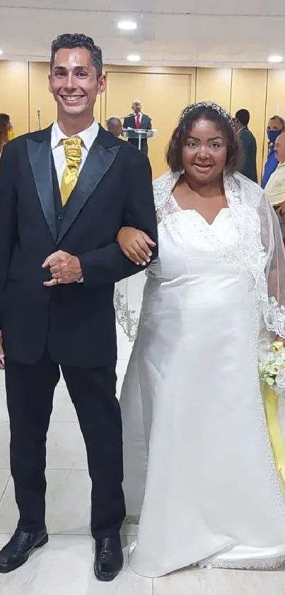 Smiling bride and groom posing at their elegant wedding.