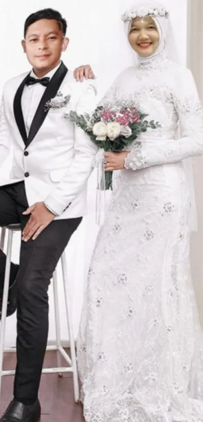 Wedding couple portrait with bride in white gown and groom in tuxedo.