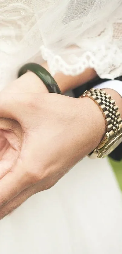 Close-up of elegant hands with jewelry, capturing wedding grace.