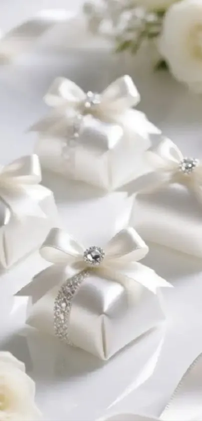 Elegant white gift boxes with ribbons and flowers for decorative use.