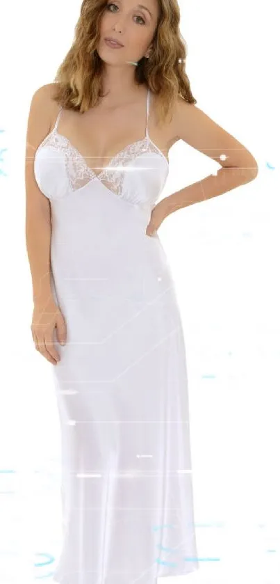 Woman in elegant white nightgown posing gracefully.