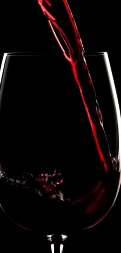 Elegant photo of wine being poured into a glass with a black background.