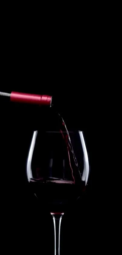 Elegant wine pouring into a glass on a dark background mobile wallpaper.