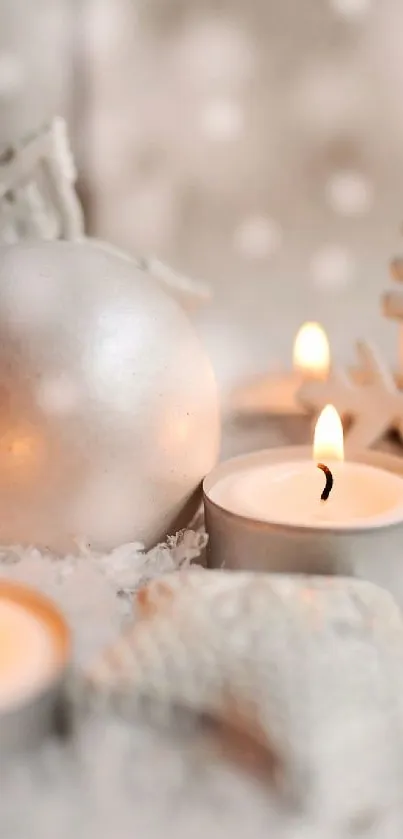 Serene winter scene with candles and silver ornaments on a snowy background.