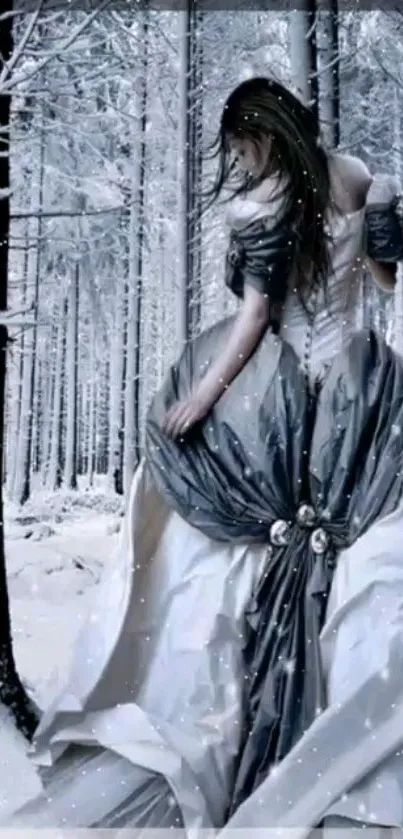 Elegant lady in a snowy forest with a flowing gray gown.