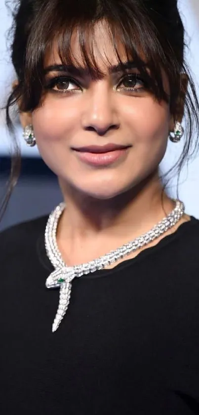 Elegant woman in black dress with jewelry.