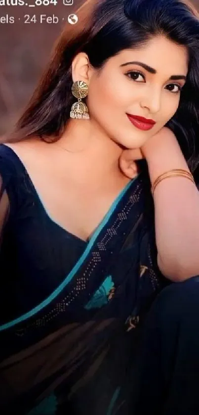 Elegant woman in black saree with red lipstick and gold earrings.